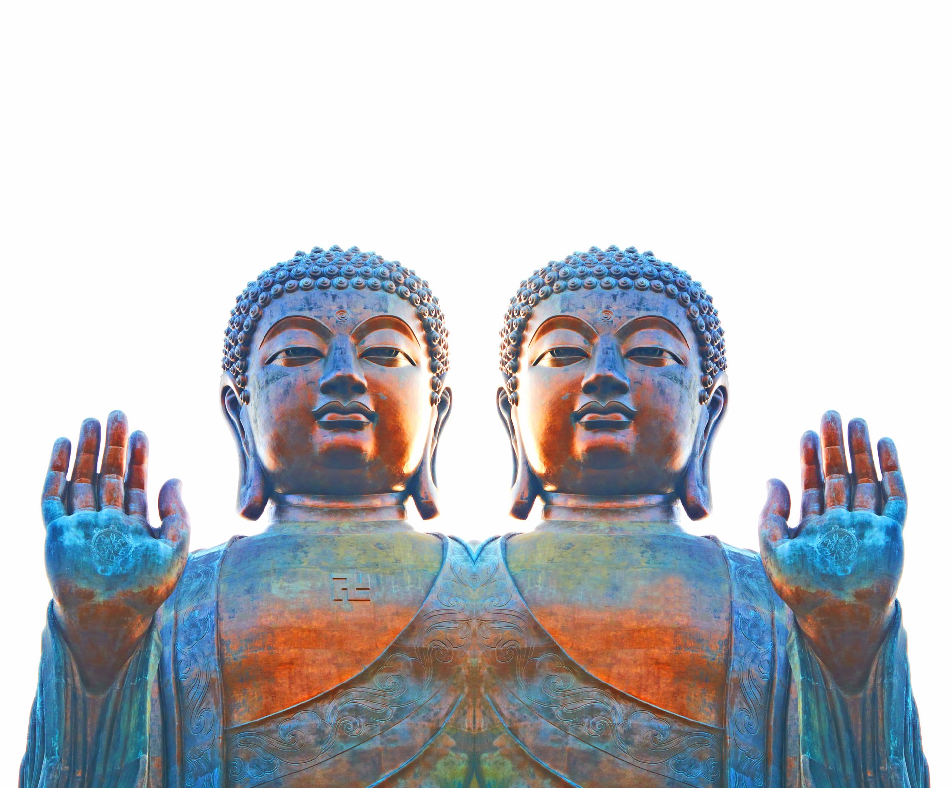 Two serene Buddha statues with raised hands symbolizing peace and harmony